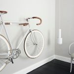 Support Velo Mural Minimaliste Noyer noir et laiton